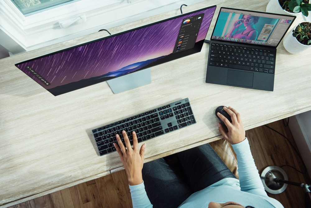 Image of a laptop and a desktop machine